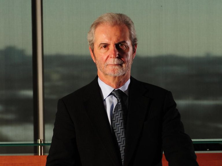Billionaire John Calamos says he’s bullish on stocks and the economy — and won’t follow Warren Buffett off stage yet