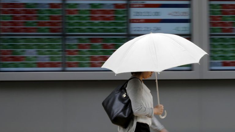 Shares advance, oil prices settle sharply lower as markets shrug off Iran conflict