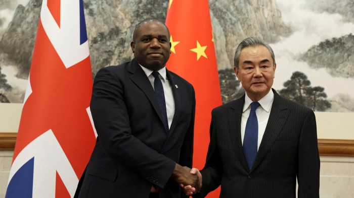 China is working to undermine UK democracy, British government says