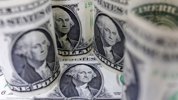 Dollar slides towards three-year low as weak US data stokes trade war fears