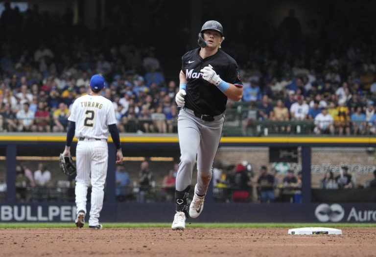 Marlins cool off Brewers to open series