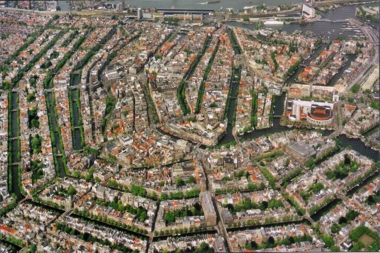 The Genius Urban Design of Amsterdam: Canals, Dams & Leaning Houses