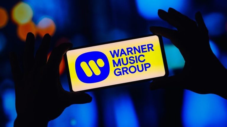 Warner Music Group and Bain launch $1.2 billion fund to buy rights; each party owns 50% of venture
